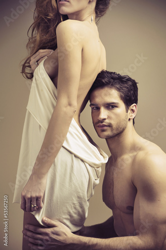 Photo: Glad hansome man touching his woman Glad hansome man touching his woman