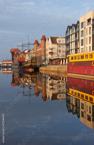 Photo: Sunrise over the river Motlawa the Old Town in Gdansk, Poland Sunrise over the river Motlawa the Old Town in Gdansk, Poland