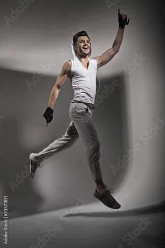 Photo: Jumping handsome man during training Jumping handsome man during training