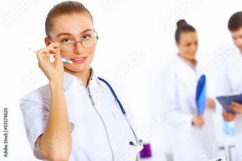 Photo: Young female doctor in white uniform Young female doctor in white uniform