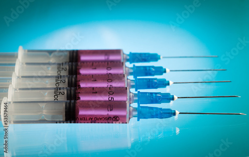 Photo: Five syringes with pink medicine Five syringes with pink medicine