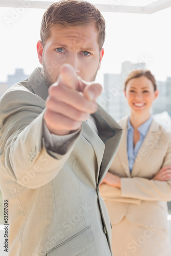 Photo: Annoyed businessman pointing at camera Annoyed businessman pointing at camera