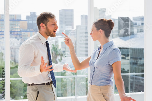 Photo: Business team having a heated argument Business team having a heated argument
