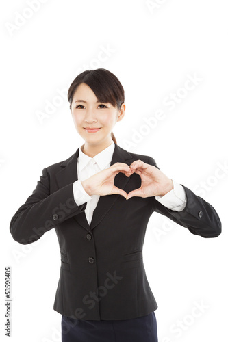 Photo: young businesswoman showing heart by her hands young businesswoman showing heart by her hands