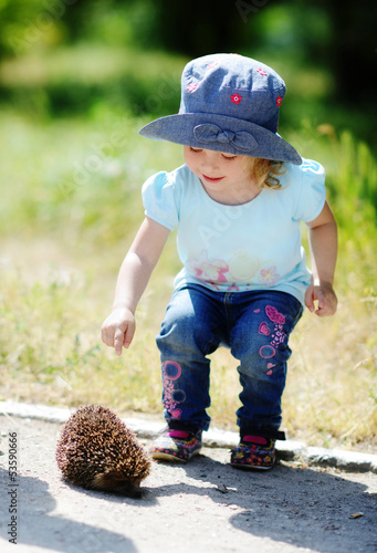 Photo: girl and hedgehog girl and hedgehog