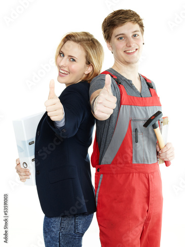 Photo: Apprentices for car mechanic and office show thumbs up Apprentices for car mechanic and office show thumbs up
