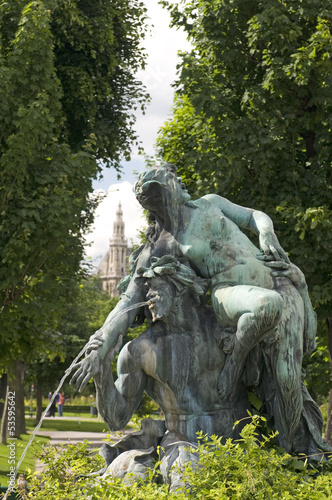 Photo: fountain sculpture Vienna Austria park with museum in backgroun fountain sculpture Vienna Austria park with museum in backgroun