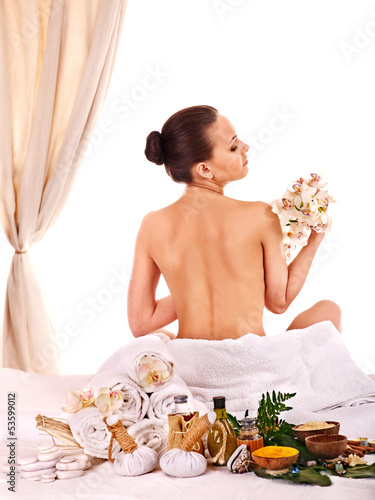 Photo: Woman wearing towel on head. Woman wearing towel on head.