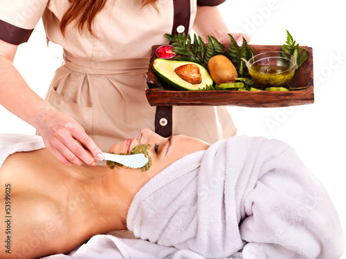 Photo: Woman getting facial mask in spa . Woman getting facial mask in spa .