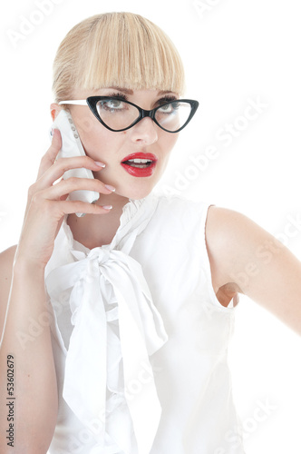 Photo: Business executive using smartphone and wearing glasses. Business executive using smartphone and wearing glasses.