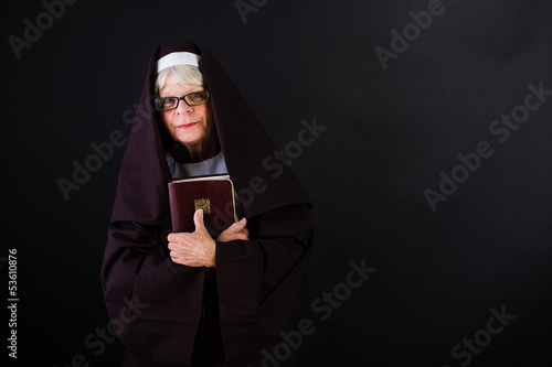 Photo: nun holding a bible nun holding a bible