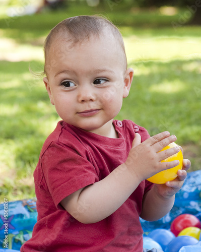 Photo: Child playing with balls Child playing with balls