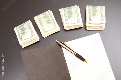 Photo: Dollars with a copybook Dollars with a copybook