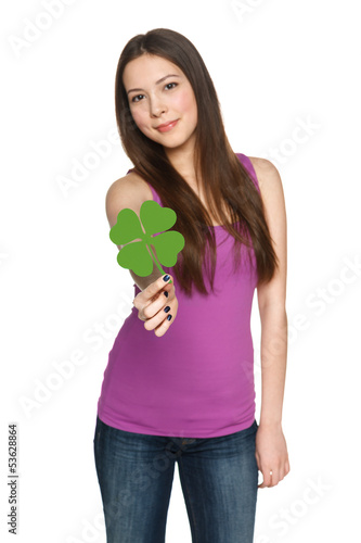 Photo: Young female giving you shamrock leaf Young female giving you shamrock leaf