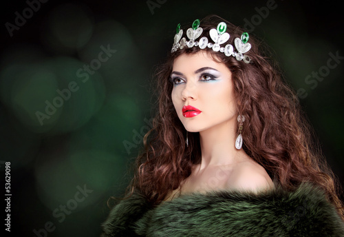 Photo: Beautiful woman luxury portrait with long hair in fur coat. Jewe Beautiful woman luxury portrait with long hair in fur coat. Jewe