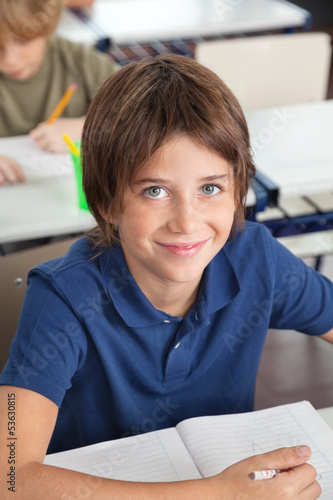 Photo: Cute Schoolboy Smiling In Classroom Cute Schoolboy Smiling In Classroom