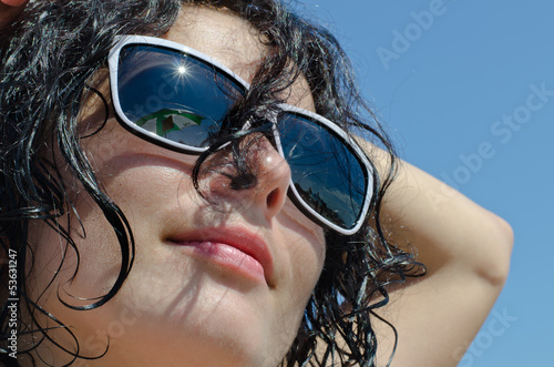 Photo: Portrait of a woman in sunglasses Portrait of a woman in sunglasses