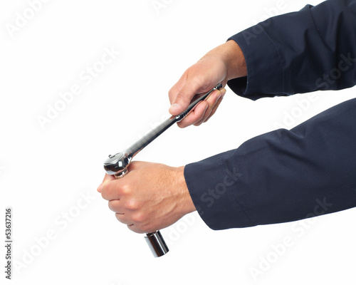 Photo: Hand of auto mechanic with wrench. Hand of auto mechanic with wrench.