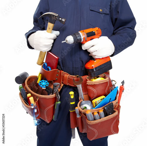 Photo: Worker with a tool belt. Worker with a tool belt.