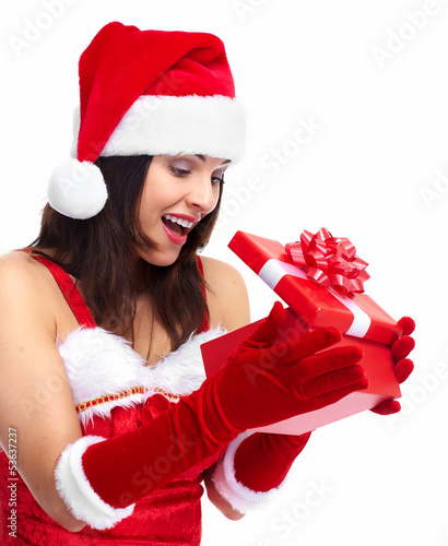 Photo: Santa helper Christmas girl with a present. Santa helper Christmas girl with a present.