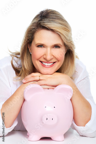 Photo: Senior woman with a piggy bank. Senior woman with a piggy bank.