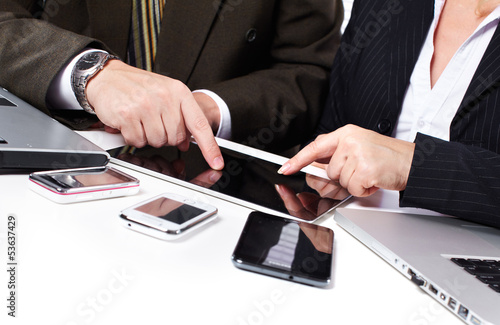Photo: Business people group working with laptop. Business people group working with laptop.