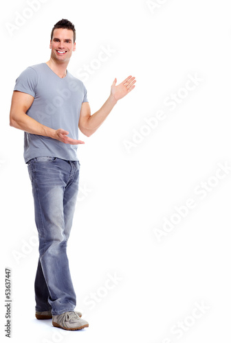 Photo: Young man presenting a copyspace. Young man presenting a copyspace.