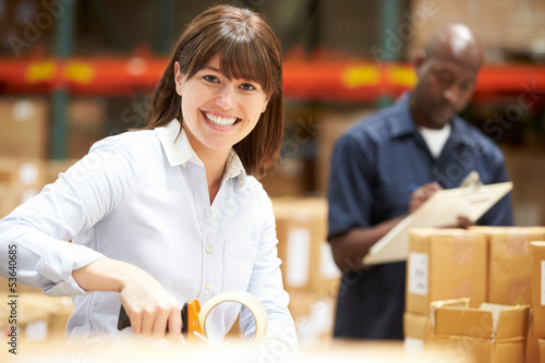 Photo: Workers In Warehouse Preparing Goods For Dispatch Workers In Warehouse Preparing Goods For Dispatch