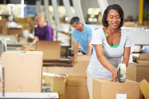Photo: Workers In Warehouse Preparing Goods For Dispatch Workers In Warehouse Preparing Goods For Dispatch