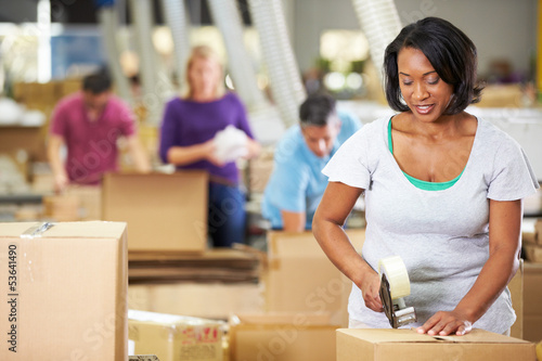 Photo: Workers In Warehouse Preparing Goods For Dispatch Workers In Warehouse Preparing Goods For Dispatch