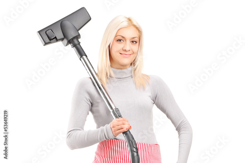 Photo: Blond housewife holding a vacuum cleaner Blond housewife holding a vacuum cleaner