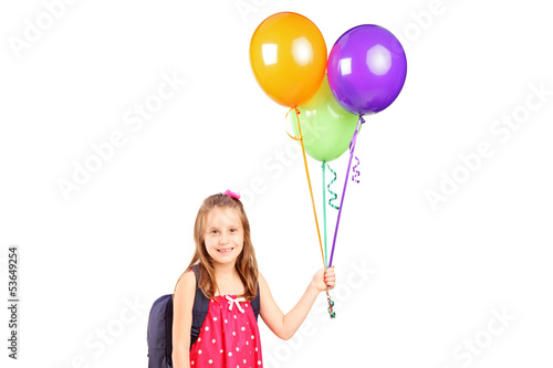 Photo: Girl holding a bunch of balloons Girl holding a bunch of balloons