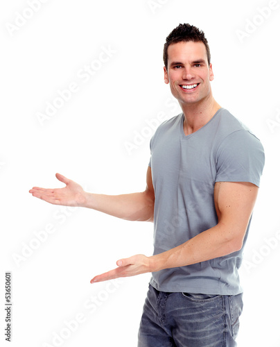 Photo: Young man presenting a copyspace. Young man presenting a copyspace.