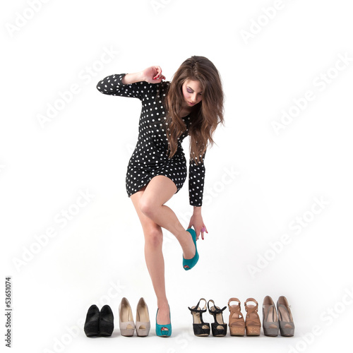 Photo: Sexy young woman trying different kinds of shoes Sexy young woman trying different kinds of shoes