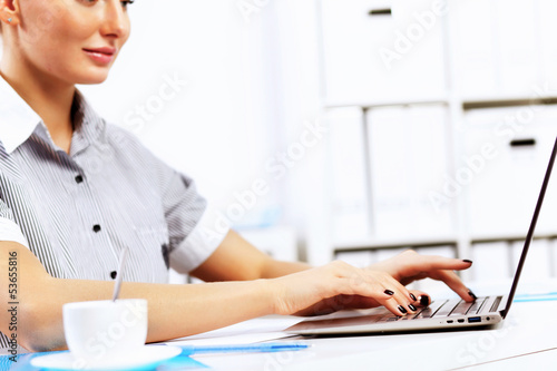 Photo: Business woman in office Business woman in office