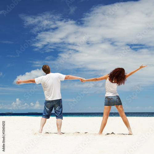 Photo: Happy couple on the beach Happy couple on the beach