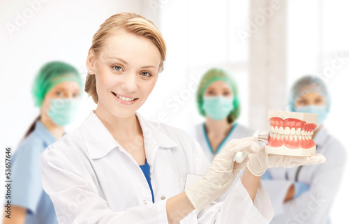 Photo: doctor with toothbrush and jaws in hospital doctor with toothbrush and jaws in hospital