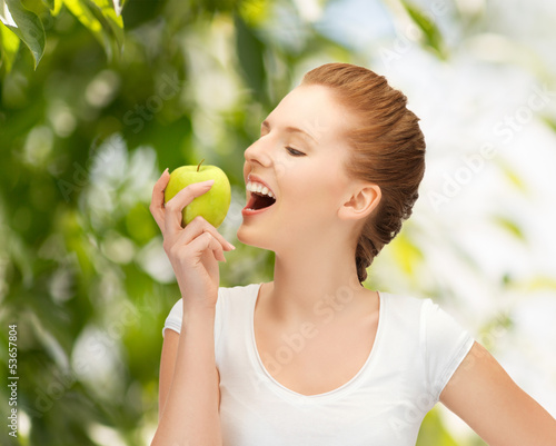 Photo: woman with green apple at countryside woman with green apple at countryside