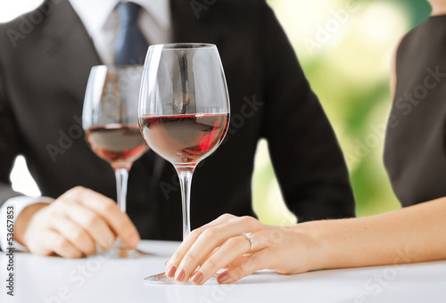 Photo: engaged couple with wine glasses engaged couple with wine glasses