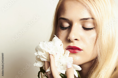 Photo: beautiful blond woman with white flower. your text here beautiful blond woman with white flower. your text here