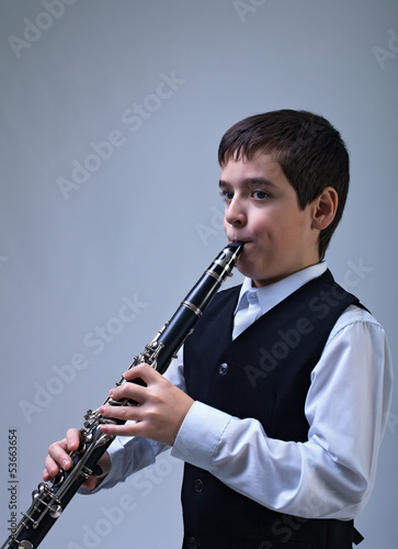 Photo: Boy playing on the clarinet Boy playing on the clarinet