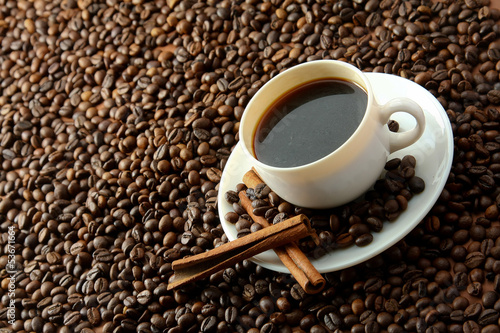 Photo: coffee beans with white cup coffee beans with white cup