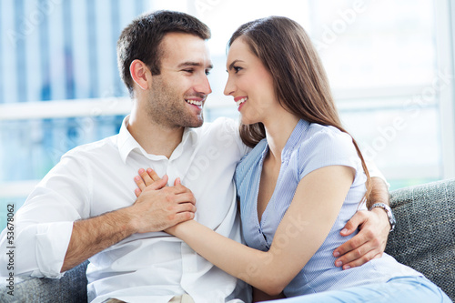 Photo: Couple hugging at home Couple hugging at home