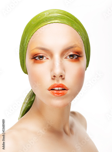 Photo: Art. Woman in Green Headwear and Trendy Professional Make-up Art. Woman in Green Headwear and Trendy Professional Make-up