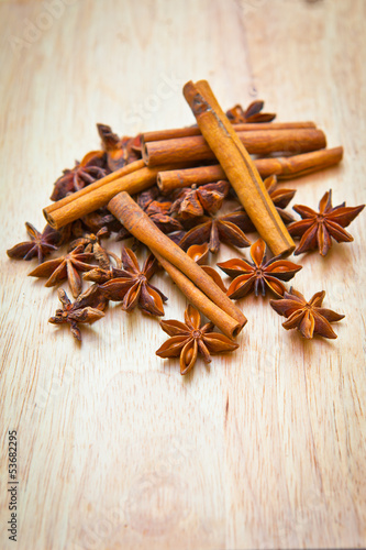Photo: Vanilla sticks and star anise on a wooden board Vanilla sticks and star anise on a wooden board