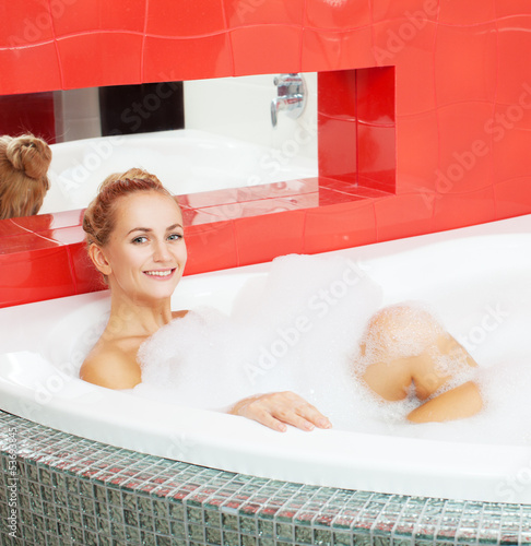 Photo: Woman in bathroom Woman in bathroom