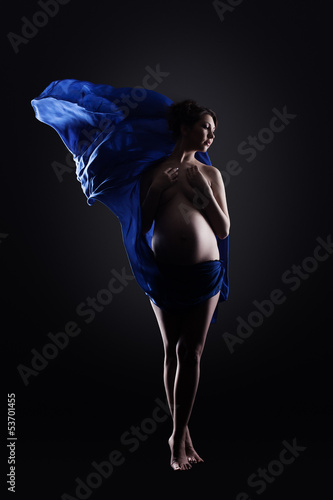 Photo: Amazing naked pregnant woman in blue cloth Amazing naked pregnant woman in blue cloth