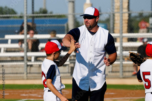 Photo: Little league baseball boy with coach Little league baseball boy with coach