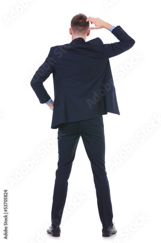 Photo: back of a pensive business man back of a pensive business man