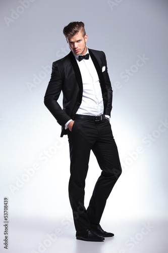 Photo: business man posing with hands in pockets business man posing with hands in pockets